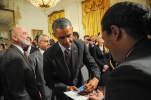 President Obama signing photographs for Georgio Sabino